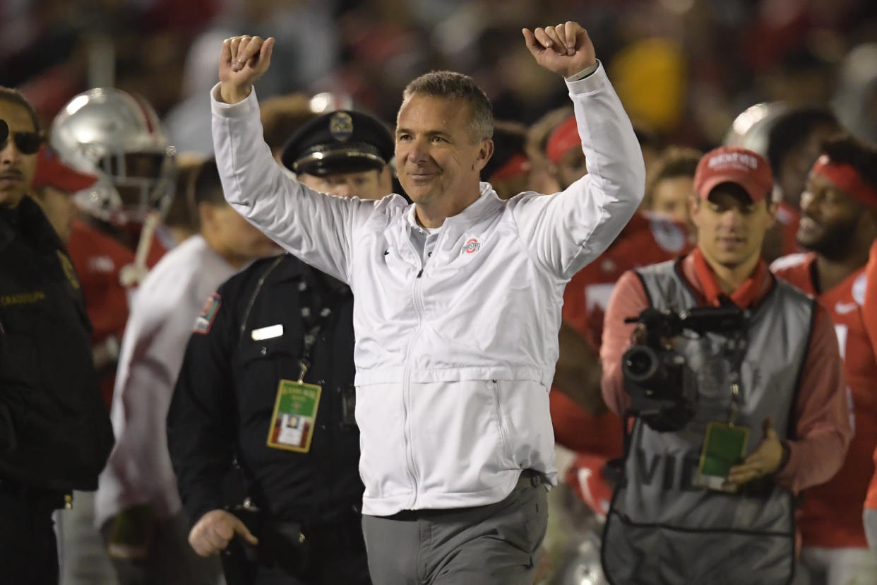 FILE - In this Tuesday, Jan. 1, 2019 file photo, Ohio State coach Urban Meyer celebrates at the end of the team's 28-23 win over Washington during the Rose Bowl NCAA college football game in Pasadena, Calif. Ohio State says the August investigation that led to a three-game suspension of football coach Urban Meyer cost the university $1 million, twice the amount originally requested for it. A school spokesman said Thursday, Jan. 3, 2019 that the initial $500,000 amount was preliminary and didn’t reflect the whole anticipated cost. (AP Photo/Mark J. Terrill, File)