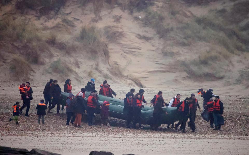 The group near the coast preparing to attempt the dangerous crossing - REUTERS