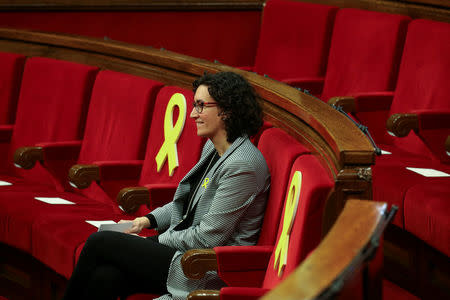 Marta Rovira, General Secretary of Republican Left of Catalonia (ERC), seats between yellow ribbons before the start of the first session of Catalan Parliament after the regional elections in Barcelona, Spain, January 17, 2018. REUTERS/Albert Gea