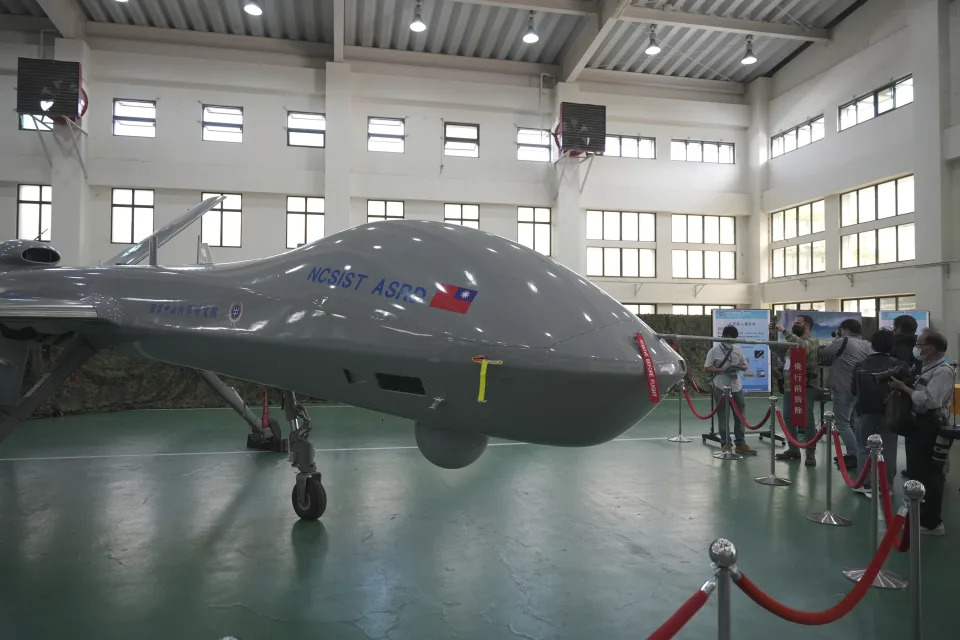 Members of the media look at the Taiwanese developed large UAV Teng Yun, which resembles the American MQ-9 Reaper and can stay aloft for up to 24 hours at the National Chung-Shan Institute of Science and Technology in Taichung in central Taiwan on Tuesday, Nov. 15, 2022. Taiwan displayed its self-developed drone technology Tuesday, amid rising concerns over China's threats to use force to assert its claim to the self-governing island republic. (AP Photo/Walid Berrazeg)