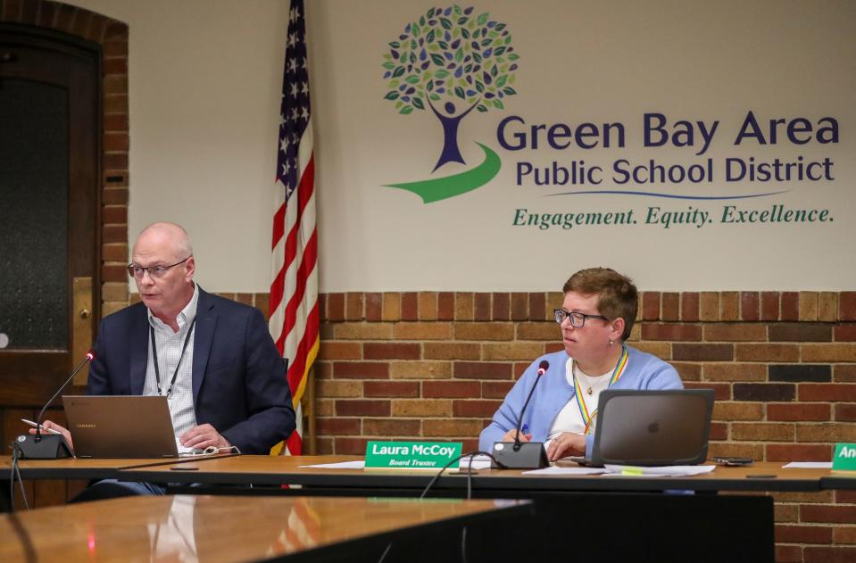 Board members James Lyerly (left) and Laura McCoy conduct candidate interviews during a School Board meeting in April.
