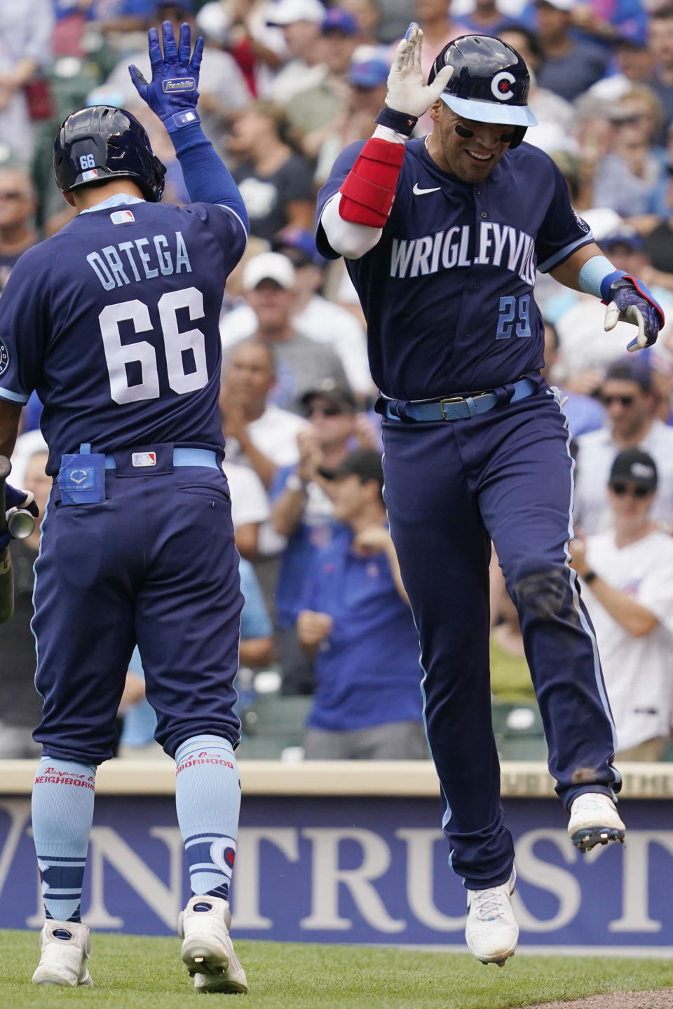 Chicago Cubs' Robinson Chirinos, right, celebrates with Rafael Ortega after hitting a solo home run during the fourth inning of a baseball game against the Arizona Diamondbacks in Chicago, Friday, July 23, 2021. (AP Photo/Nam Y. Huh)