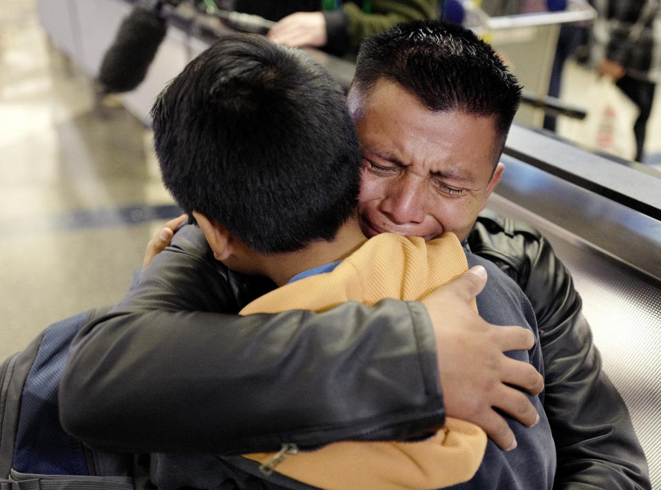 David Xol-Cholom of Guatemala hugs his son Byron at Los Angeles International Airport on Wednesday, Jan. 22, 2020, when they reunited after being separated during the Trump administration's wide-scale separation of immigrant families. / Credit: Ringo H.W. Chiu / AP