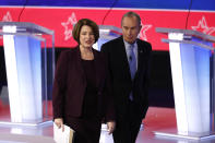 Democratic presidential candidates former New York City Mayor Mike Bloomberg walks with Sen. Amy Klobuchar, D-Minn., after a Democratic presidential primary debate at the Gaillard Center, Tuesday, Feb. 25, 2020, in Charleston, S.C., co-hosted by CBS News and the Congressional Black Caucus Institute. (AP Photo/Patrick Semansky)