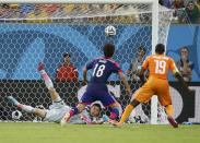 Japan's Eiji Kawashima saves the ball during the 2014 World Cup Group C soccer match between Ivory Coast and Japan at the Pernambuco arena in Recife June 14, 2014. REUTERS/Yves Herman