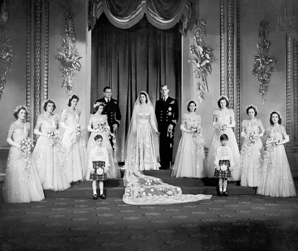 Princess Elizabeth and the Duke of Edinburgh with their eight bridesmaids in the Throne Room at Buckingham Palace on their wedding dayPA