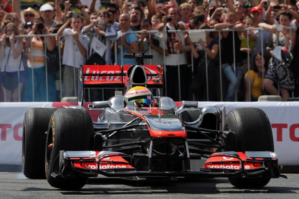 Formula One McLaren Mercedes' British driver Lewis Hamilton speeds during the "Moscow City Racing" show on July 15, 2012 in central Moscow. AFP PHOTO / KIRILL KUDRYAVTSEVKIRILL KUDRYAVTSEV/AFP/GettyImages