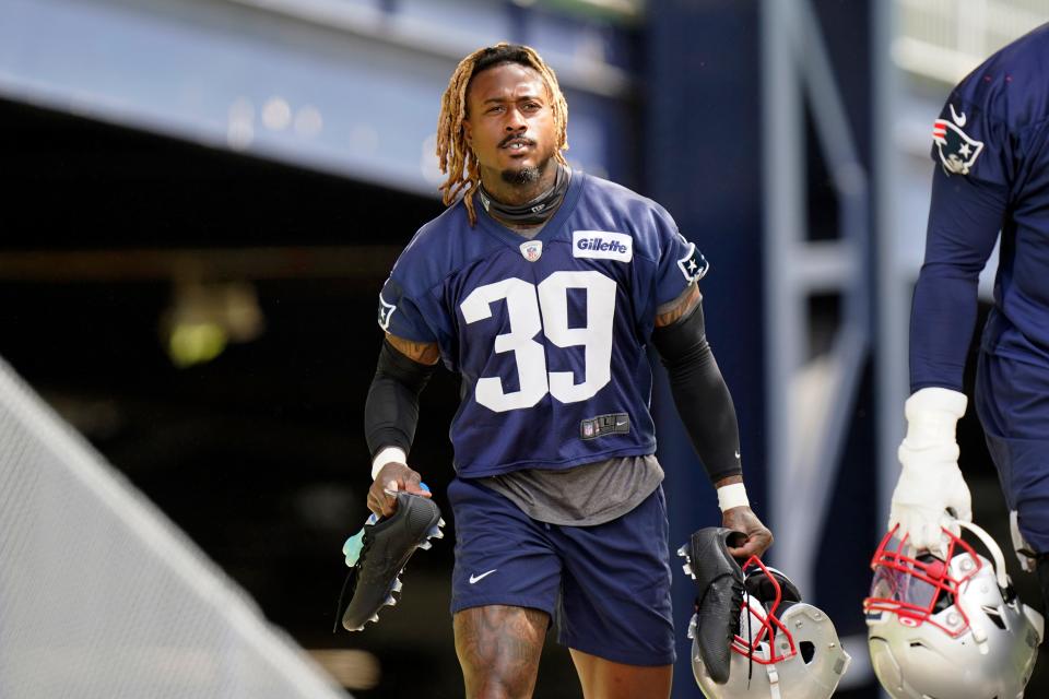 Patriots defensive back Terrance Mitchell heads for the practice field in May. Even though he often practiced with the starting team, Mitchell was cut by New England on Tuesday.