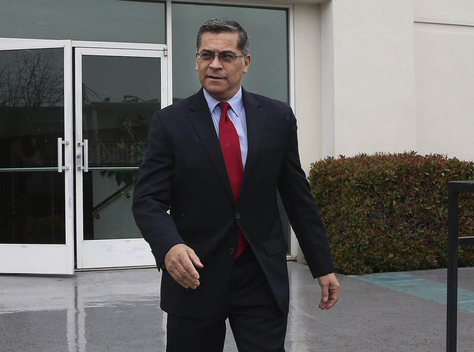 California Attorney General Xavier Becerra leaves leaves the Calvary Christian Center after meeting with SeQuette Clark, Tuesday, March 5, 2019, in Sacramento, Calif. Becerra is expected later today to announce the results of his criminal investigation into the shooting death of Clark's son, Stephon Clark, by Sacramento police officers last year. (AP Photo/Rich Pedroncelli)