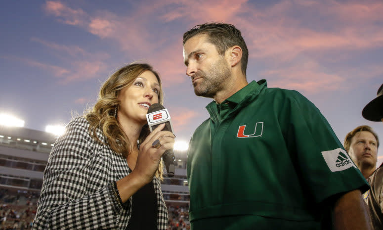 ESPN sideline reporter Allison Williams interviews Miami head coach Manny Diaz.