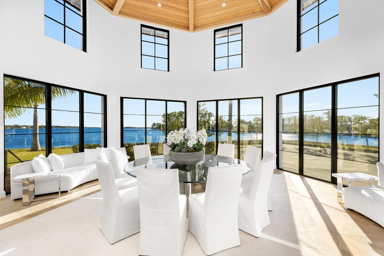 The octagonally shaped dining room and tennis pavilion is on the far west side of the house, overlooking the tennis court at 10 Tarpon Island in Palm Beach.