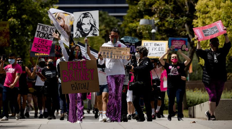 Supporters hold signs during a rally for pop star Britney Spears during a conservatorship case hearing at Stanley Mosk Courthouse in Los Angeles