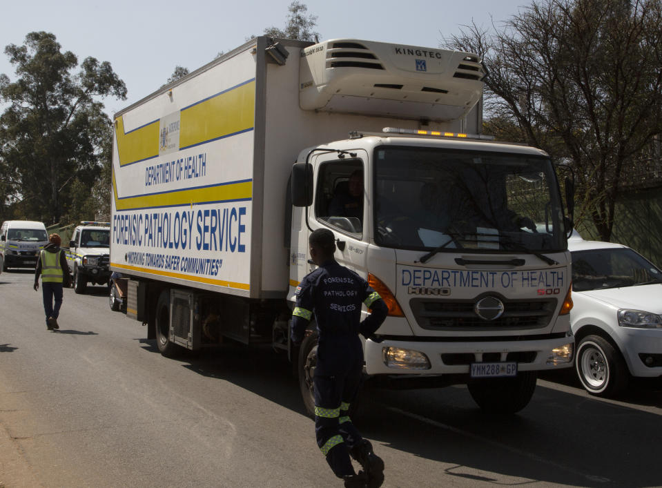 A truck arrives at a forensic mortuary in Soweto, Johannesburg, South Africa, Friday, Sept. 1, 2023, following one of South Africa's deadliest inner-city fires as pathologists faced the grisly task Friday of identifying dozens of charred bodies and some separate body parts that had been transported to several mortuaries across the city of Johannesburg. (AP Photo/Denis Farrell)