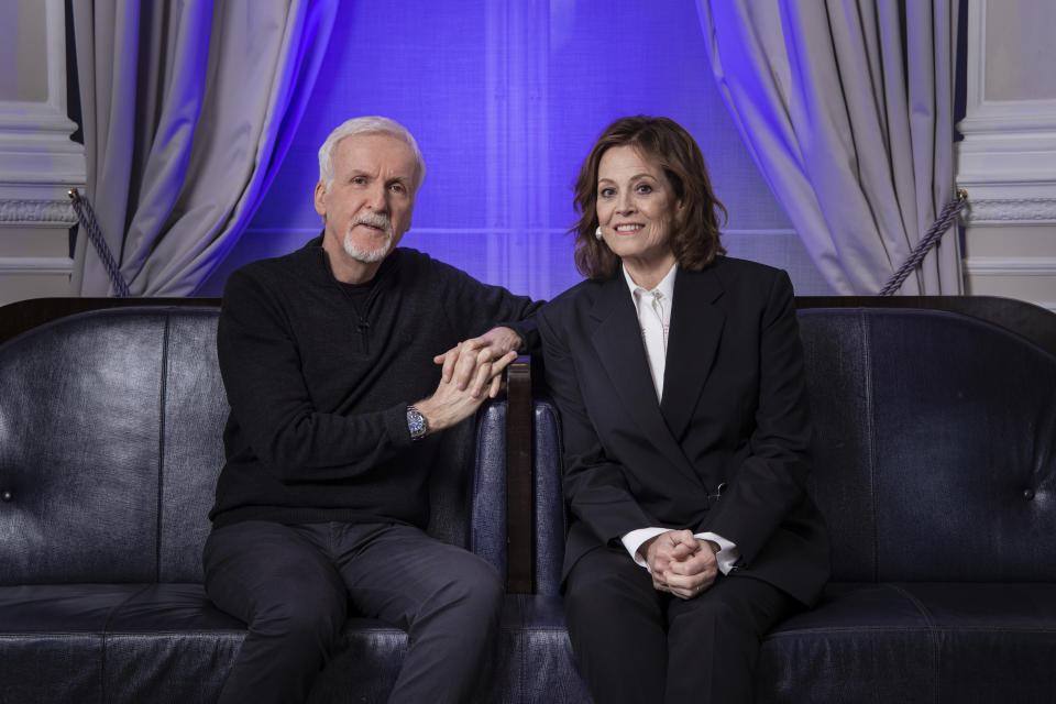 Director James Cameron, left, and Sigourney Weaver pose for a photo to promote the film "Avatar: The Way of Water" in London, Sunday, Dec. 4, 2022. (Photo by Vianney Le Caer/Invision/AP)