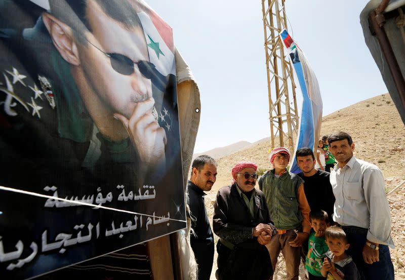 FILE PHOTO: Syrian refugees who left Lebanon arrive in Qalamoun