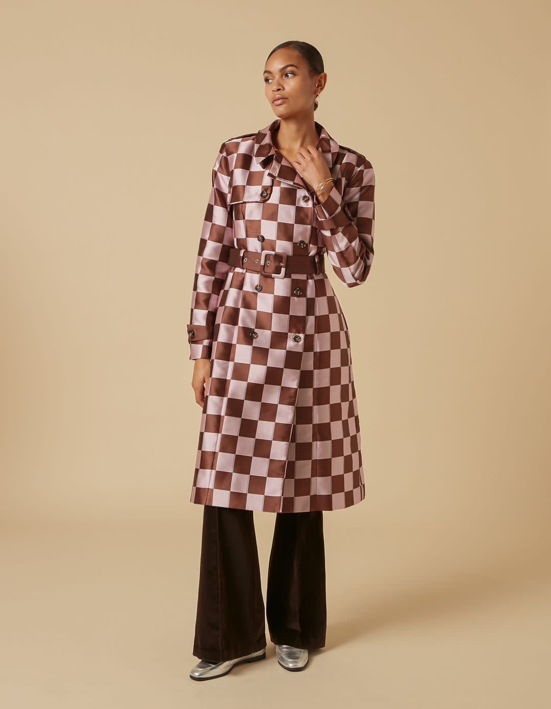 <p><a href="https://lisou.co.uk/collections/emily-in-paris-edit/products/andy-pink-brown-puzzle-trenchcoat" rel="nofollow noopener" target="_blank" data-ylk="slk:Shop Now;elm:context_link;itc:0;sec:content-canvas" class="link rapid-noclick-resp">Shop Now</a></p> <p>Emily Pink Brown Puzzle Print Trench Coat</p> <p>lisou.co.uk</p> <p>£300.00</p>