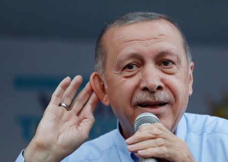 FILE PHOTO: Turkish President Tayyip Erdogan gestures during a rally in Mardin, capital of Mardin province in southeastern Turkey, June 20, 2018. REUTERS/Goran Tomasevic/File Photo