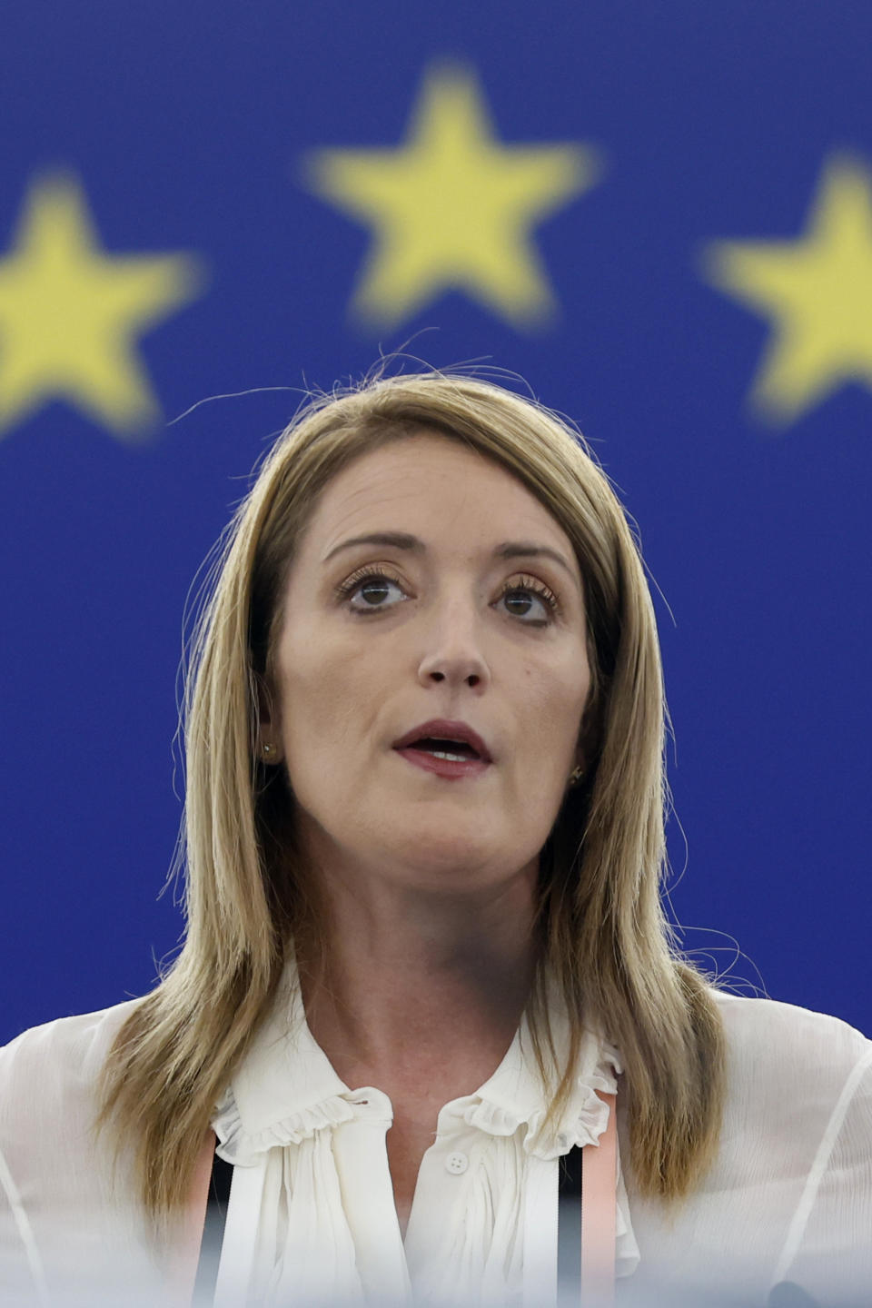 European Parliament President Roberta Metsola delivers her speech during a special session on lobbying Monday, Dec. 12, 2022 at the European Parliament in Strasbourg, eastern France. Four people have been charged with being part of a criminal group, money laundering and corruption in connection with an investigation into suspected influence peddling by a Persian Gulf country at the European Union's parliament. (AP Photo/Jean-Francois Badias)