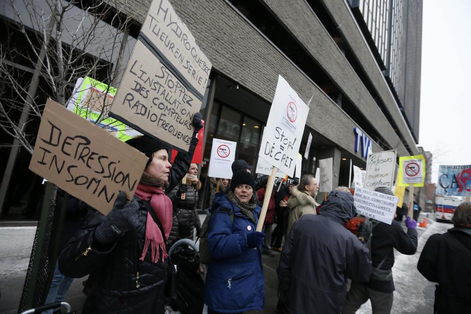 Protesters gather outside a local television station prior to the arrival of the leaders of Quebec's political parties for the second debate in Montreal, March 27, 2014. Quebec voters will go to the polls in a provincial election on April 7. REUTERS/Christinne Muschi (CANADA - Tags: POLITICS CIVIL UNREST)