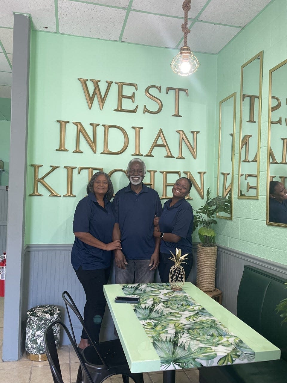 (left to right) Lucia, William, and Toni Stridiron smile in their new brick-and-mortar restaurant.