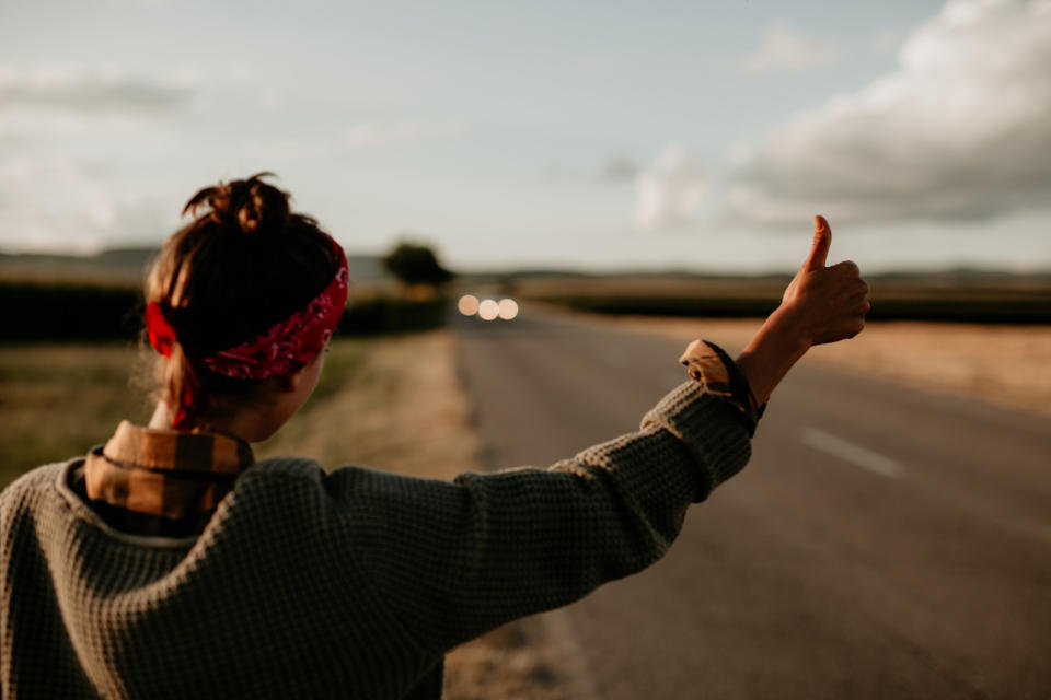 A hitchhiker hailing a ride.