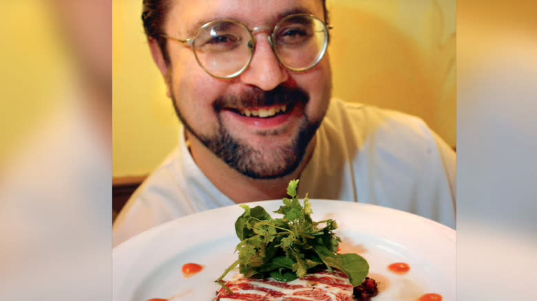 David Ruggerio smiling with plate