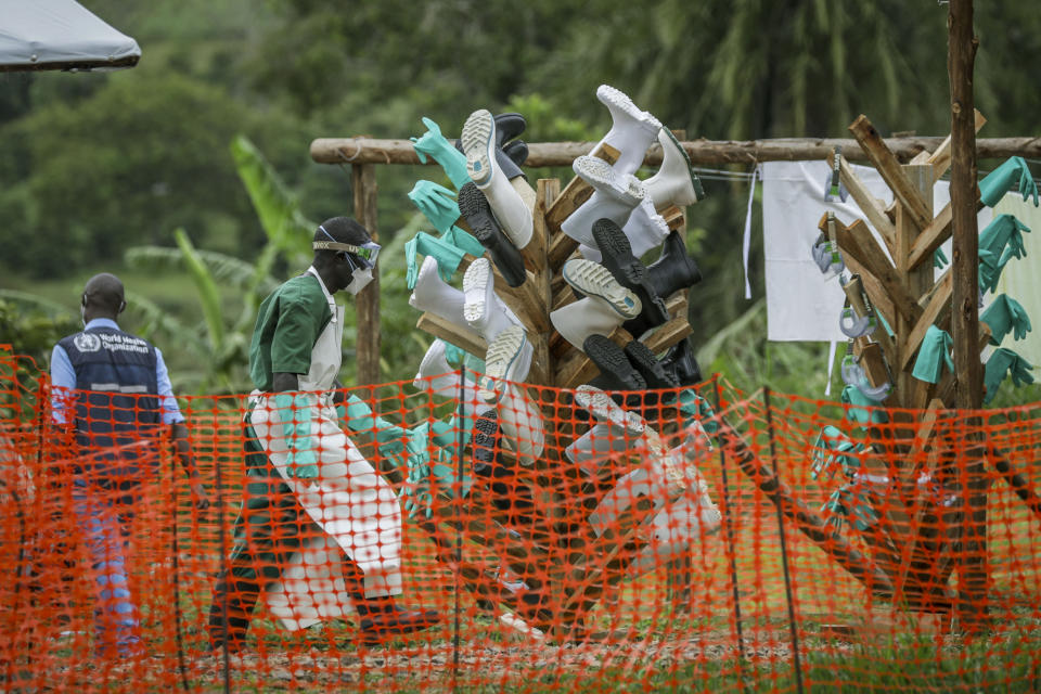 Protective boots are hung up to dry after being disinfected inside the Ebola isolation center of Madudu Health Center III, in the village of Madudu, in the Mubende district of Uganda, Tuesday, Nov. 1, 2022. Ugandan health officials say they have controlled the spread of a strain of Ebola that has no proven vaccine, but there are pockets of resistance to health measures among some in rural communities where illiteracy is high and restrictions on movement and business activity have left many bitter. (AP Photo/Hajarah Nalwadda)