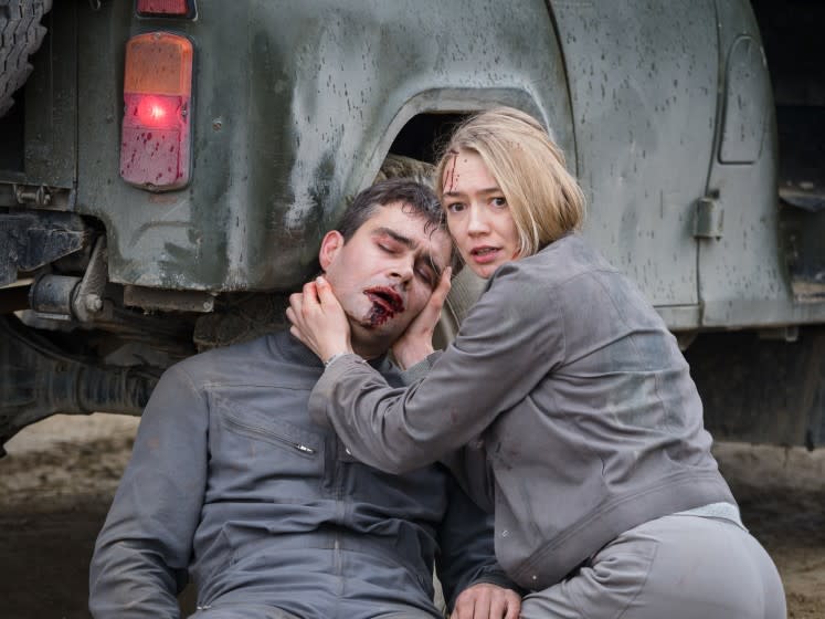 Pyotr Fyodorov and Oksana Akinshinain in the movie "Sputnik."