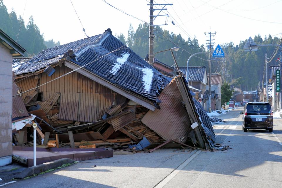 Collapsed houses are seen after multiple strong earthquakes the previous day on 2 January in Wajima, Ishikawa, Japan (The Asahi Shimbun via Getty Imag)