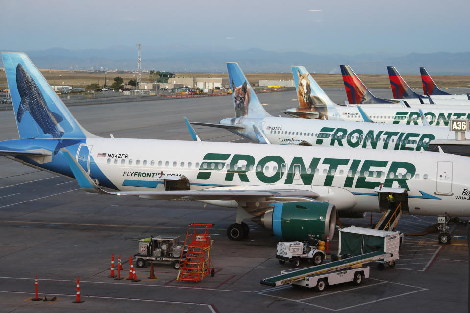 FILE - Frontier Airlines jets sit at gates at Denver International Airport on Sept. 22, 2019, in Denver. Shareholders of Spirit Airlines will vote Thursday, June 29, 2022, on a proposed merger with Frontier Airlines, and the outcome could affect fares for millions of air travelers who depend on the budget airlines. (AP Photo/David Zalubowski, File)