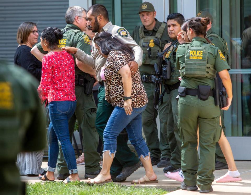 People leave the Uvalde Civic Center following a shooting earlier in the day at Robb Elementary School, Tuesday, May 24, 2022, in Uvalde, Texas. 