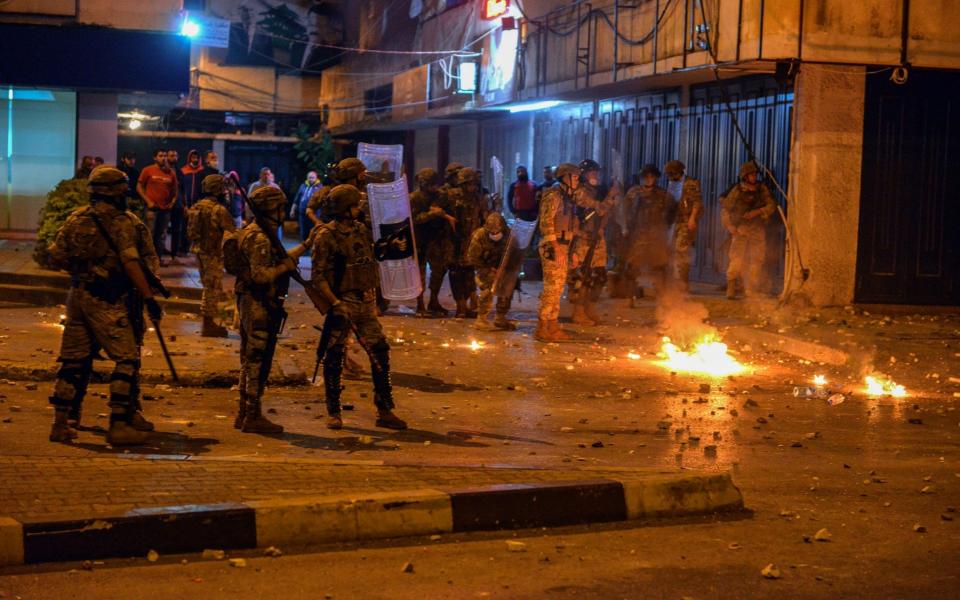 Lebanese army soldiers during clashes with demonstrators in northern city of Tripoli, Lebanon - EPA