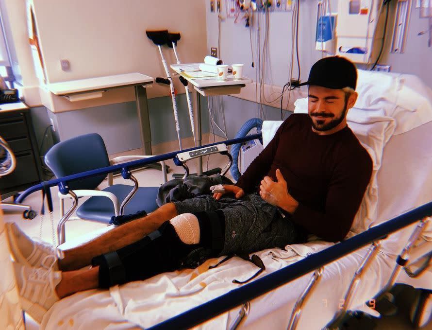 Zac Efron was doing his best to smile through the pain after tearing his ACL on Feb. 8, 2019. The “Extremely Wicked, Shockingly Evil and Vile” was the epitome of grinning and bearing it from his hospital bed in Los Angeles on Friday, as seen on Instagram. “tore my ACL shredding the gnar […] but all is good,” he captioned the photo. “I opted for surgery so I can come back stronger than ever. Thank you to Dr. Kvitne and his team at Kerlan-Jobe Surgery Center. I’ll keep you updated as I heal and progress! Thanks for all the love and positivity!”