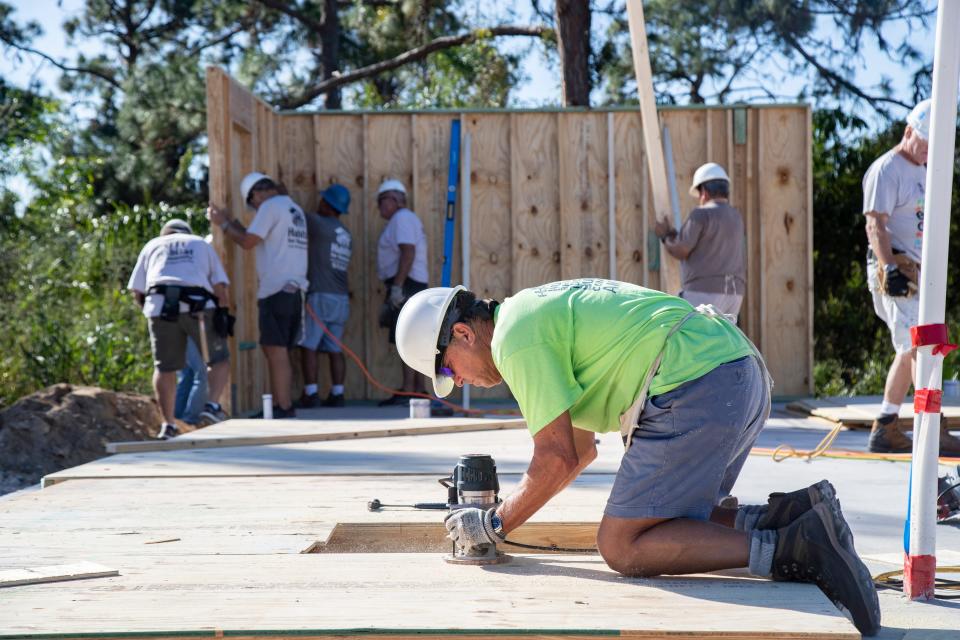 John Hill, a Habitat for Humanity volunteer, works on a home on Friday, November 4, 2022, in Bonita Springs. The project is the first to begin since Hurricane Ian. 