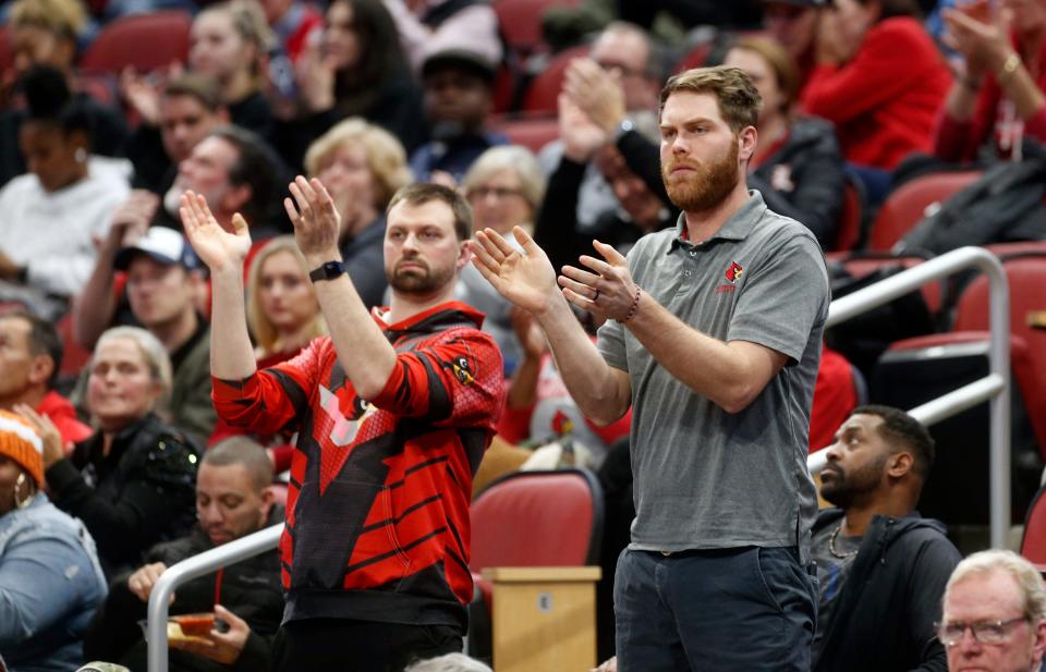 Louisville fans watch the game against Arkansas State at the KFC Yum! Center on Dec. 13.