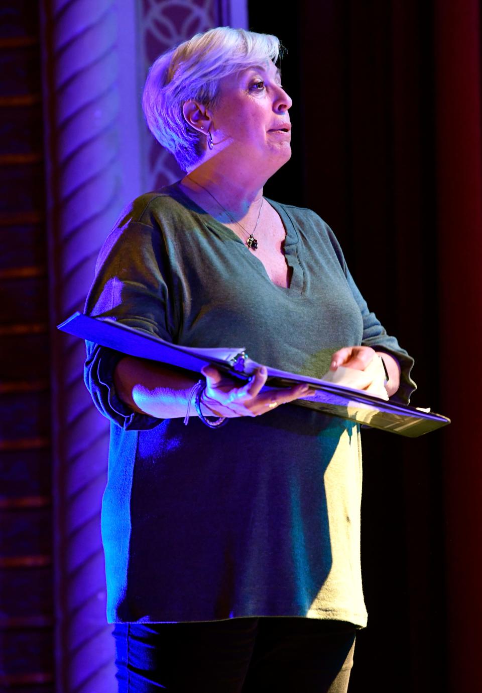 Director Neena McLain works out a scene with the cast during Tuesday's rehearsal.