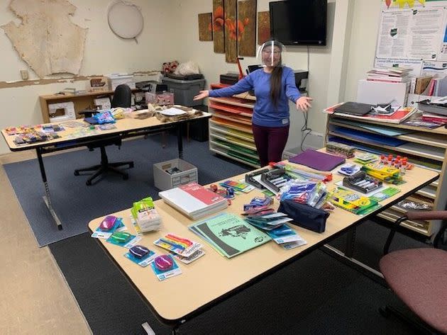 A teacher at Helen Kalvak School in Nunavut with school supplies donated from Facebook group