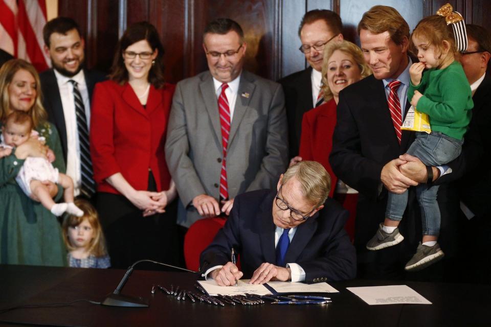Gov. Mike DeWine signs Ohio's six-week abortion ban into law in 2019.