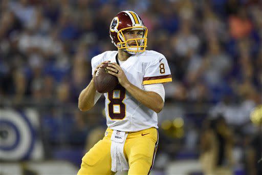 Washington Redskins quarterback Kirk Cousins looks for a receiver in the first half of a preseason NFL football game against the Baltimore Ravens, Saturday, Aug. 29, 2015, in Baltimore. (AP Photo/Gail Burton)