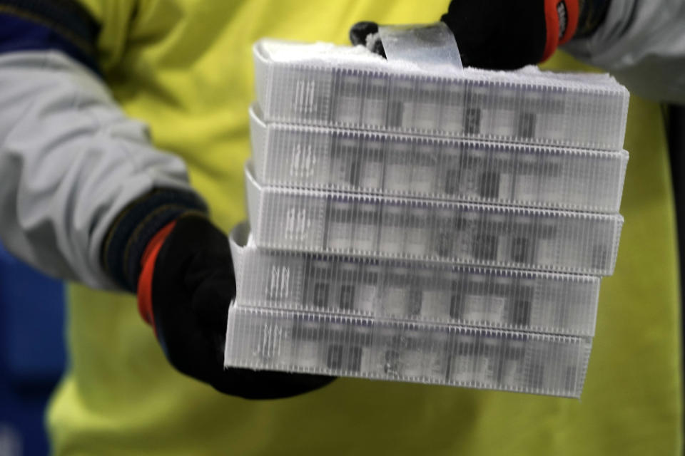 FILE - In this Dec. 13, 2020, file photo, boxes containing the Pfizer-BioNTech COVID-19 vaccine are prepared to be shipped at the Pfizer Global Supply Kalamazoo manufacturing plant in Portage, Mich. Michigan announced Wednesday, March 3, 2021, that everyone ages 50 to 64 can start getting COVID-19 vaccinations on March 22 and that those in that group with certain medical conditions can begin being immunized next week. (AP Photo/Morry Gash, Pool, File)