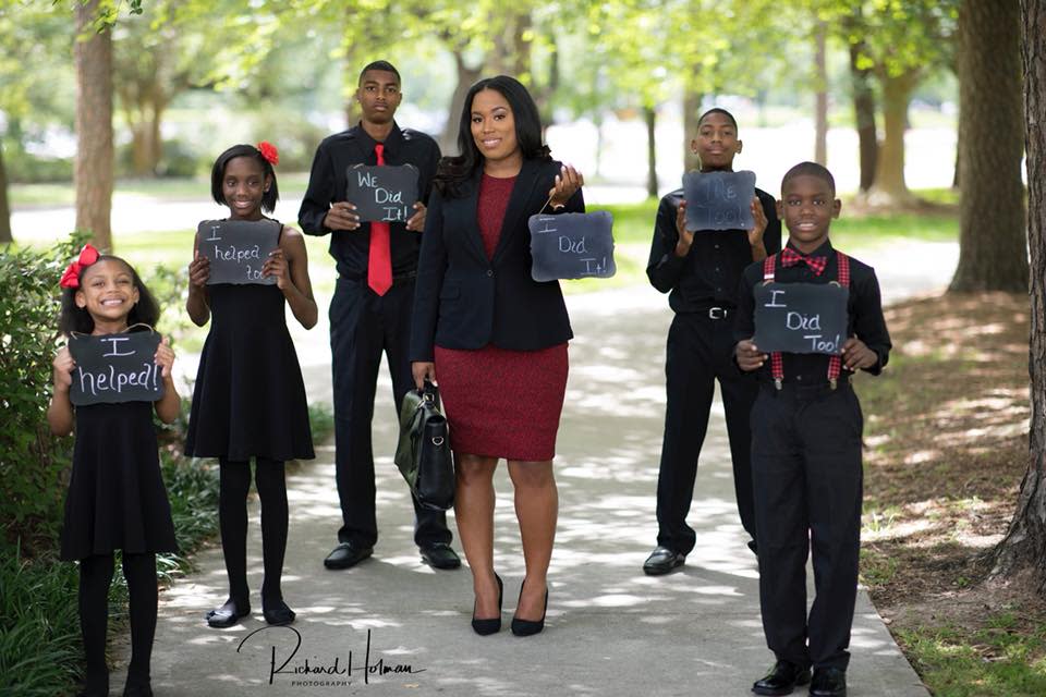 Champs’s children pose proudly around her. (Photo: <a href="http://www.rhphotostudio.com/" rel="nofollow noopener" target="_blank" data-ylk="slk:Richard Holman Photography;elm:context_link;itc:0;sec:content-canvas" class="link ">Richard Holman Photography</a>)