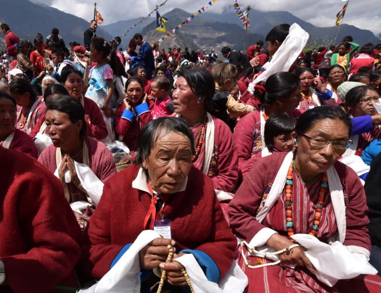 Buddhist followers listen during teachings by exiled Tibetan spiritual leader the Dalai Lama at the Sangdok Palri Monastery in the Tewang District near the Chinese border in India's north-eastern state of Arunachal Pradesh on April 7, 2017