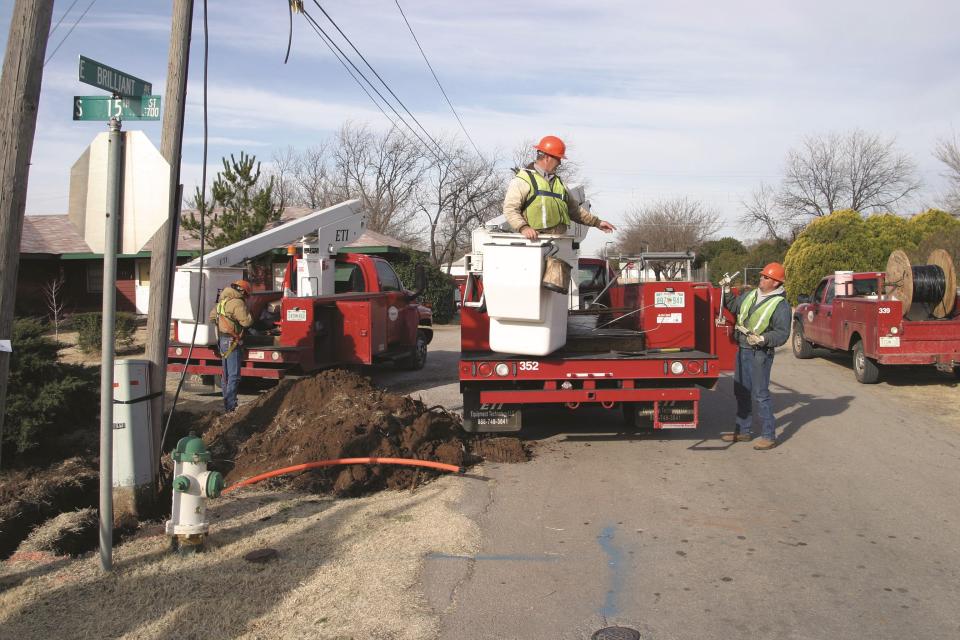 Fiber splitters work on an installation project in Frederick.