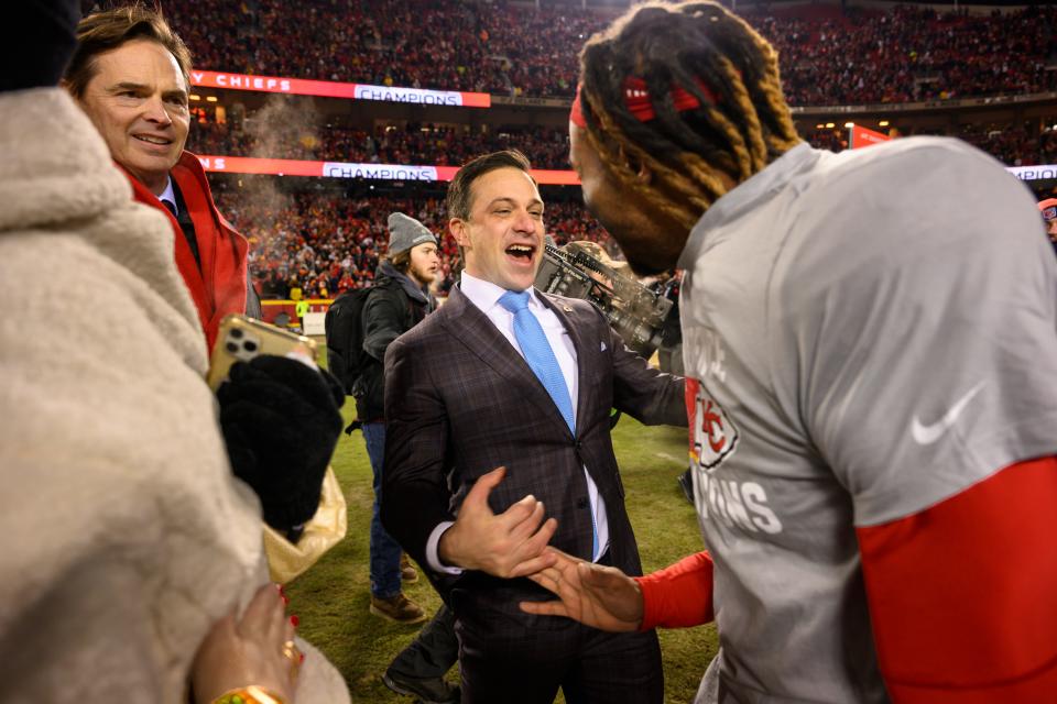 Kansas City Chiefs General Manager Brett Veach, center, celebrates with Chiefs safety Justin Reid, right, as Chiefs President Mark Donovan, left, looks on after they beat the Cincinnati Bengals in the NFL AFC Championship playoff football game, Sunday, Jan. 29, 2023 in Kansas City, Mo.