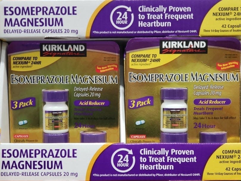 white, purple, and yellow box with purple and gold back of acid reflux medicine at costco