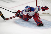 New York Rangers goaltender Keith Kinkaid (71) makes a save on a shot by Boston Bruins right wing David Pastrnak (88) during the third period of an NHL hockey game, Saturday, May 8, 2021, in Boston. Kinkaid left the game after the save with an apparent injury. (AP Photo/Charles Krupa)