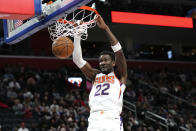 Phoenix Suns center Deandre Ayton (22) dunks against the Detroit Pistons in the first half of an NBA basketball game in Detroit, Saturday, Feb. 4, 2023. (AP Photo/Paul Sancya)