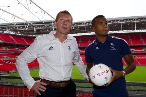 Britain's Olympic football coach Stuart Pearce (L) poses for a photo with Chelsea player Ryan Bertrand, on July 2, after a press conference at Wembley Stadium in London, to announce the squad for the 2012 Olympic Games