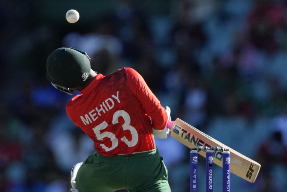 Bangladesh's Mehidy Hasan evades a bouncer during the T20 World Cup cricket match between South Africa and Bangladesh in Sydney, Australia, Thursday, Oct. 27, 2022. (AP Photo/Rick Rycroft)