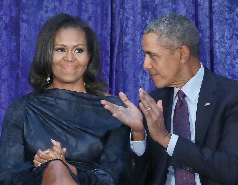 Former U.S. President Barack Obama and first lady Michelle Obama participate in the unveiling of their official portraits during a ceremony at the Smithsonian's National Portrait Gallery on Feb. 12, 2018.